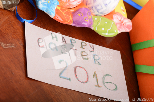 Image of holiday gift box with painted easter eggs