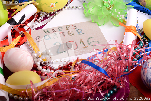 Image of Easter background with eggs, ribbons and spring decoration