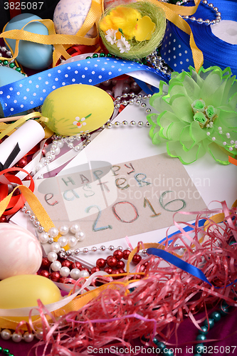 Image of Easter background with eggs, ribbons and spring decoration