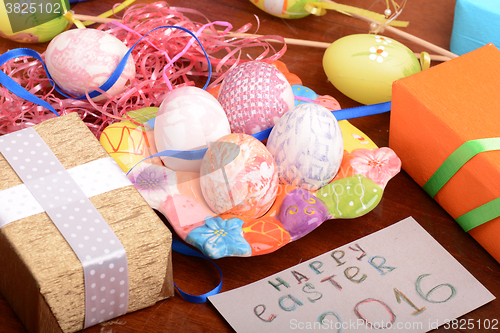 Image of holiday gift box with painted easter eggs