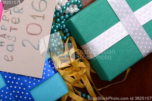 Image of easter eggs with flowers and gift box 