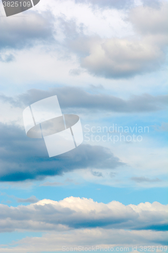 Image of blue sky background with tiny clouds