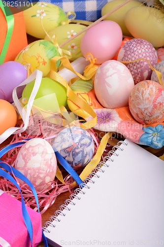 Image of Easter background with eggs, ribbons and spring decoration