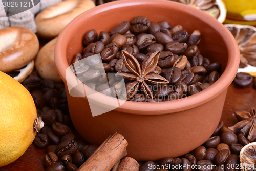 Image of Vintage still life with coffee beans on wooden background