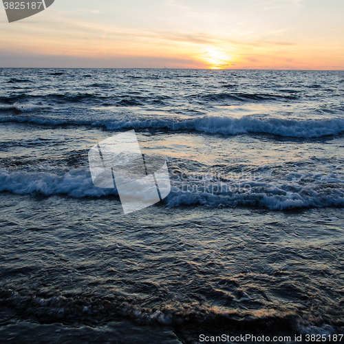 Image of Twilight with sunset and waves