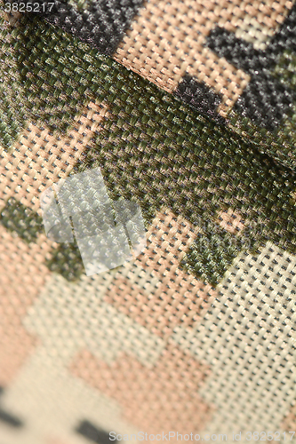 Image of Close up of military uniform fabric.