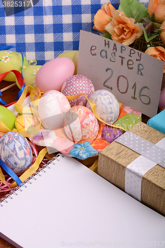 Image of hand made eggs at a gift box, happy easter invitation card