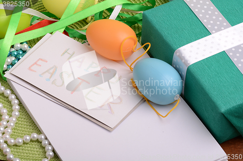 Image of Easter background with Easter eggs with spring flowers/ vintage easter card with basket