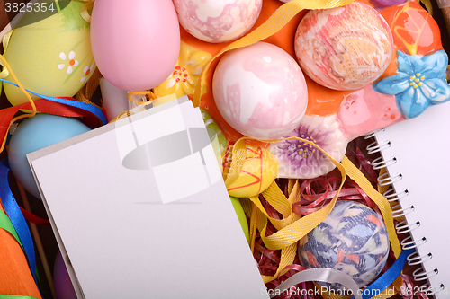 Image of Easter background with eggs, ribbons and spring decoration