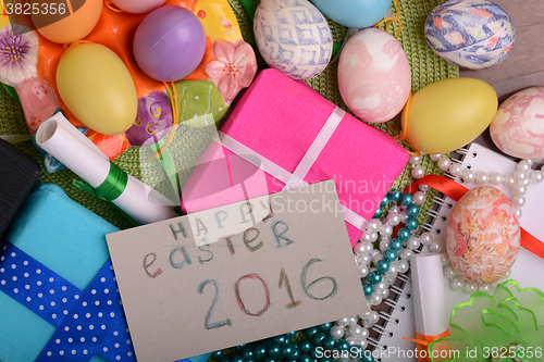 Image of easter eggs with flowers and gift box 