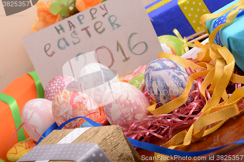 Image of Easter background with eggs, ribbons and spring decoration