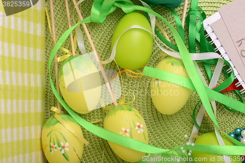 Image of Easter background with Easter eggs with spring flowers/ vintage easter card with basket