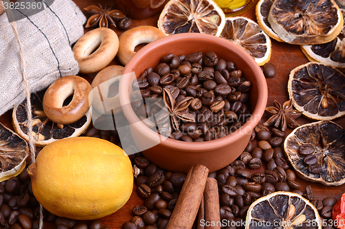 Image of coffee beans and candle. lemon and cinnamon. anise and aroma spice
