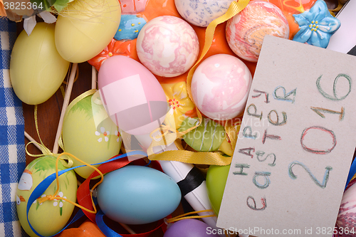 Image of Easter background with eggs, ribbons and spring decoration