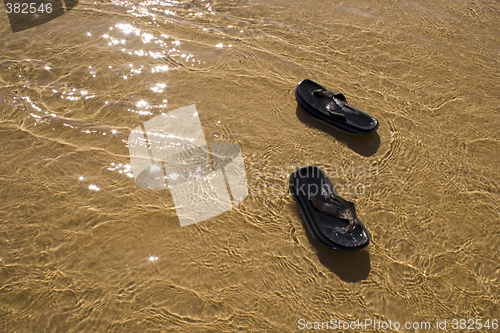 Image of Sandals in the water