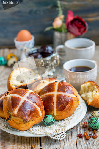 Image of Breakfast with the Easter buns with raisins.