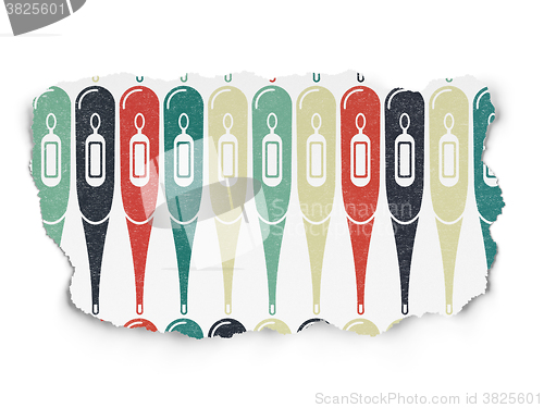 Image of Healthcare concept: Thermometer icons on Torn Paper background