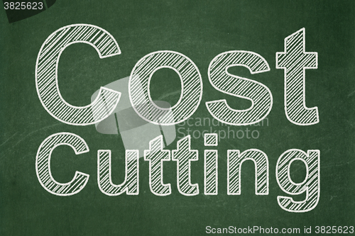 Image of Business concept: Cost Cutting on chalkboard background