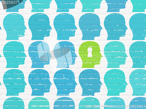 Image of Finance concept: head with keyhole icon on wall background