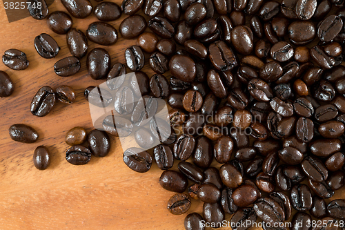 Image of Roasted coffee bean over wooden background