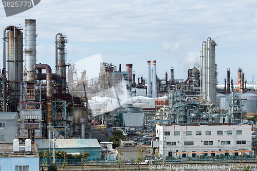 Image of Industrial plant with smoke from the chimney