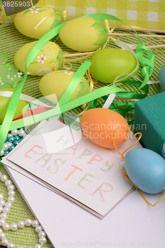 Image of Easter background with Easter eggs with spring flowers/ vintage easter card with basket