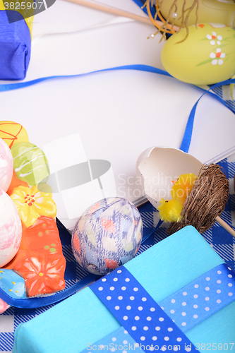 Image of Assorted Easter coloured eggs in the paper egg box