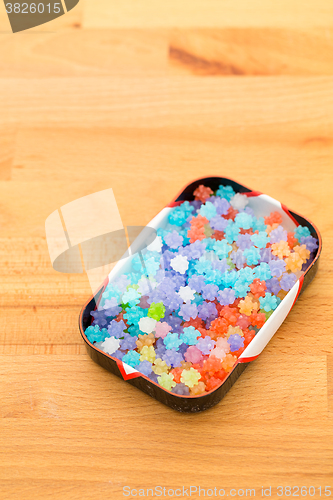 Image of Box of japanese candy on wooden background
