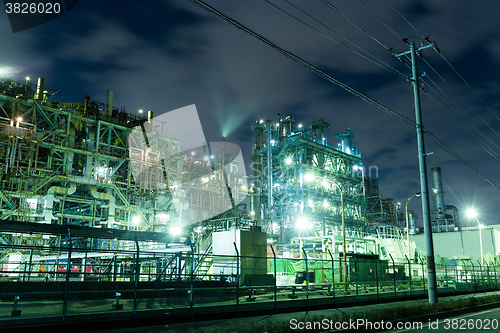 Image of Oil refinery petrochemical industrial at night