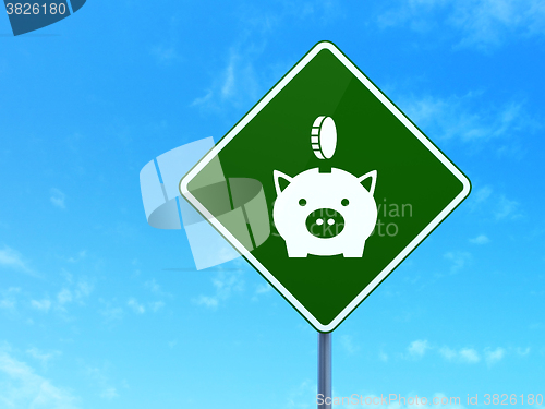Image of Money concept: Money Box With Coin on road sign background