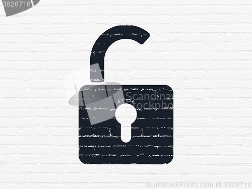 Image of Safety concept: Opened Padlock on wall background