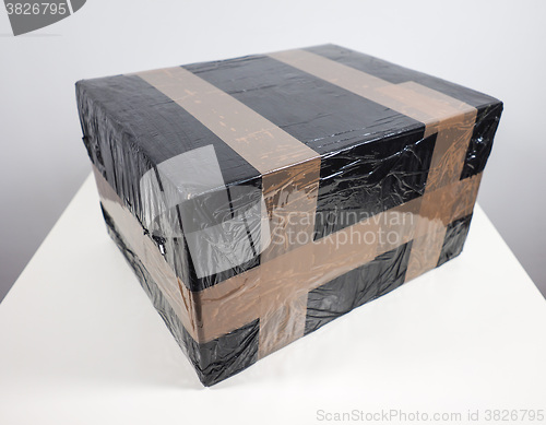 Image of Black packet parcel