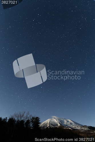 Image of Starry night with snow mountain