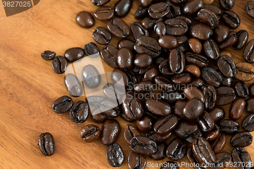 Image of Roasted coffee bean on grunge wood table