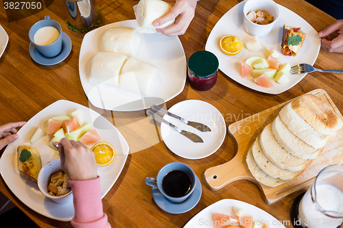 Image of Group of people having breakfast together