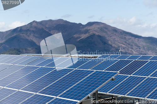 Image of Solar panel with mountain background