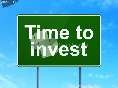 Image of Time concept: Time To Invest on road sign background