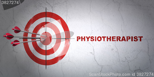 Image of Health concept: target and Physiotherapist on wall background