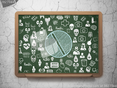 Image of Health concept: Pill on School Board background