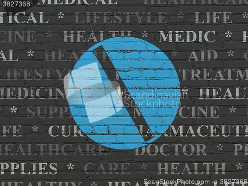 Image of Medicine concept: Pill on wall background