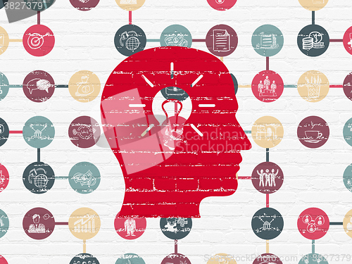 Image of Business concept: Head With Light Bulb on wall background