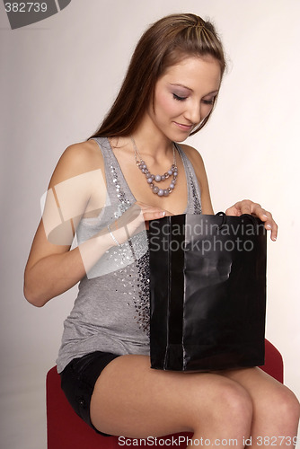 Image of woman with purchase bag