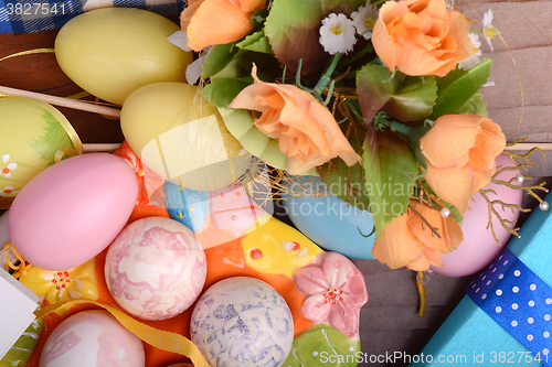 Image of Easter background with eggs, ribbons and spring decoration