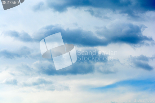 Image of blue sky background with tiny clouds