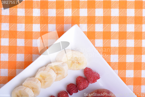 Image of peach raspberries bananas close up as health food concept