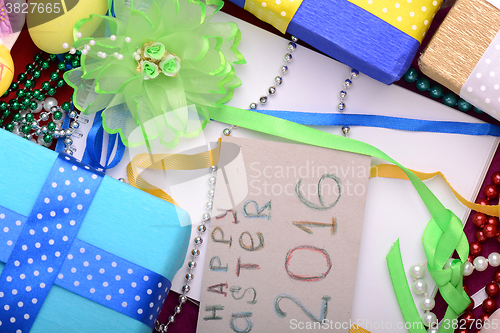 Image of Easter background with eggs, ribbons and spring decoration