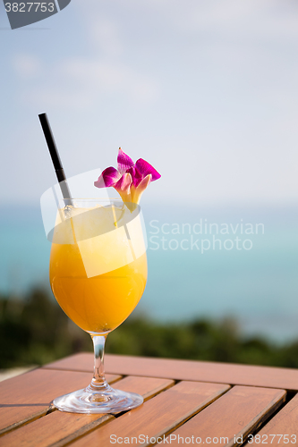 Image of Pineapple juice at restaurant beside sea