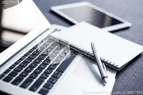 Image of Social media device and note book 