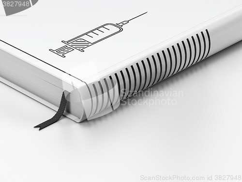 Image of Health concept: closed book, Syringe on white background