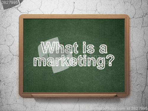 Image of Advertising concept: What is a Marketing? on chalkboard background